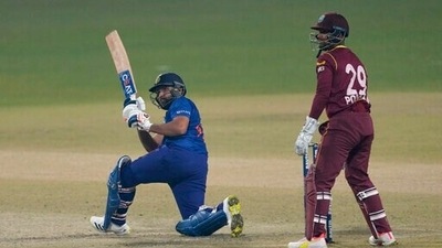 India’s captain Rohit Sharma, left, bats during the first Twenty20 international cricket match between India and West Indies in Kolkata, India. (AP)