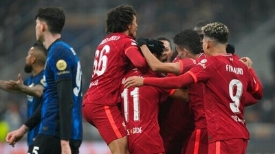 Liverpool's Mohamed Salah celebrates with his teammates after scoring his side's second goal during the Champions League, round of 16, first leg soccer match between Inter Milan and Liverpool at the San Siro stadium in Milan, Italy, (AP)