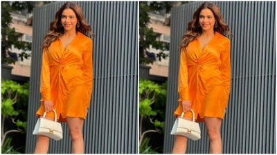 Aamna's dress came with quarter sleeves, collared neckline and a folded detail near to the waist. Aamna accessorised her short dress with a white bag. (Instagram/@aamnasharifofficial)