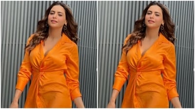 Aamna wore her tresses open in wavy curls with a middle part and added golden earrings to complete her look. (Instagram/@aamnasharifofficial)