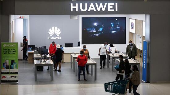 Customers and workers are seen at a Huawei store at Sandton City mall in Sandton, South Africa. Beijing has expressed concern over India’s decision to ban 54 apps over security reasons and Indian tax authorities conducting raids at multiple premises of Huawei. (REUTERS)