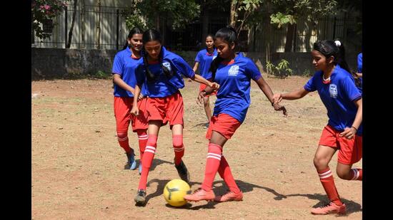 One of Navi Mumbai Municipal Corporation schools girls football team at a practice session. Following HT’s report highlighting the efforts of the girls, Thane-based Aniket Foundation has decided to sponsor jerseys for the football team of school No.103 in Airoli. (BACHCHAN KUMAR/HT FILE PHOTO)