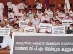 Opposition MLAs stage a protest outside Kerala Assembly on Friday. (ANI Twitter)