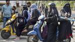 Burqa-clad female Muslim students arrive to attend a class at ATNC College, Shivamogga, February. 17, 2022 (PTI) Burqa-clad female Muslim students arrive to attend a class at ATNC College, Shivamogga, February. 17, 2022 (PTI)
