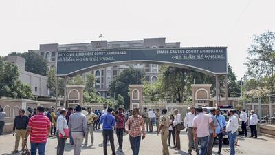 Ahmedabad police and media outside the session court during the sentence day of 2008 Ahmedabad serial bomb blast case, in Ahmedabad on Friday. (PTI)