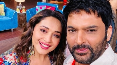 Madhuri Dixit with Kapil Sharma on his show. Madhuri Dixit with Kapil Sharma on his show. 