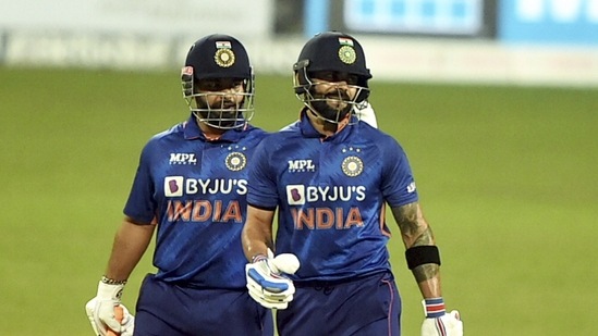 Indian batter Virat Kohli being greeted by Rishabh Pant after scoring fifty runs during 2nd T20 cricket match against West Indies, at Eden Garden in Kolkata, Friday,Feb. 18, 2022.(PTI)