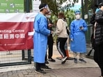 Carrie Lam and her government have struggled to curtail a widening outbreak of the coronavirus in Hong Kong. In picture - People enter a Covid-19 testing centre in Hong Kong.(AFP) Carrie Lam and her government have struggled to curtail a widening outbreak of the coronavirus in Hong Kong. In picture - People enter a Covid-19 testing centre in Hong Kong.(AFP)