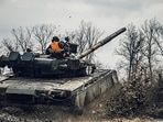A service member of the Ukrainian Naval Infantry Corps (Marine Corps) drives a tank during drills at a training ground in an unknown location in Ukraine. (Reuters)&nbsp;(via REUTERS)