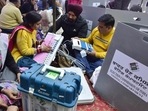 Polling staff examining EVMs and other voting material at a distribution centre on the eve of Punjab elections in Amritsar on Saturday. (Sameer Sehgal/HT) Polling staff examining EVMs and other voting material at a distribution centre on the eve of Punjab elections in Amritsar on Saturday. (Sameer Sehgal/HT)