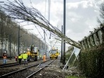 Workers carry out repair work on an overhead line and a railway in Maarssen on February 19, 2022, after the storm Eunice in northern Europe. At least 13 people were killed by falling trees, flying debris and high winds in Britain, Ireland, the Netherlands, Belgium, Germany and Poland, emergency services said. (Photo by Remko de Waal / ANP / AFP) Workers carry out repair work on an overhead line and a railway in Maarssen on February 19, 2022, after the storm Eunice in northern Europe. At least 13 people were killed by falling trees, flying debris and high winds in Britain, Ireland, the Netherlands, Belgium, Germany and Poland, emergency services said. (Photo by Remko de Waal / ANP / AFP)