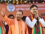 Uttar Pradesh chief minister Yogi Adityanath flashes the victory sign during an election campaign meeting in support of party candidate Rajeshwar Singh at Sarojni Nagar, in Lucknow.