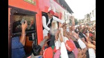 Samajwadi Party (SP) president, Akhilesh Yadav greets the supporters during a roadshow ahead of the Uttar Pradesh Assembly Election, in Kanpur on Friday. (Arshad Khan)