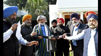 Prime Minister Narendra Modi being felicitated by the Afghan Hindu-Sikh delegation at his residence in New Delhi on Saturday. (ANI)