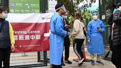Carrie Lam and her government have struggled to curtail a widening outbreak of the coronavirus in Hong Kong. In picture - People enter a Covid-19 testing centre in Hong Kong. (AFP) Carrie Lam and her government have struggled to curtail a widening outbreak of the coronavirus in Hong Kong. In picture - People enter a Covid-19 testing centre in Hong Kong. (AFP)