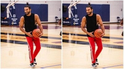 Ranveer paired a black tank top with a pair of red joggers with white stripes in the sides. (Instagram/@ranveersingh)