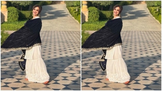 Patralekhaa paired a white chikankari kurta with a pair of white sharara intricately embroidered in white resham threads. Patralekhaa teamed it with a velvet black dupatta decorated in white threads at the borders.(Instagram/@patralekhaa)