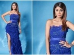 Shilpa Shetty often wears show-stopping outfits from famous international designers to judge shows and attend events. In her latest Instagram stills, the actor can be seen looking gorgeous in a cobalt blue thigh-high slit strapless dress.(Instagram/@theshilpashetty)