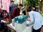 Polling officials collecting the Electronic Voting Machine (EVMs) and other necessary inputs required for the Punjab Assembly Election, at a distribution centre, in Amritsar.(ANI) Polling officials collecting the Electronic Voting Machine (EVMs) and other necessary inputs required for the Punjab Assembly Election, at a distribution centre, in Amritsar.(ANI)