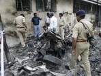 Forensic experts collecting evidence from a blast site outside the Civil Hospital in Ahmedabad. The photo was taken on July 27, 2008. (AFP)