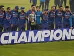 Indian players pose with the winners trophy after their win in the third Twenty20 international cricket match against West Indies in Kolkata, India, Sunday, Feb. 20, 2022. Indian won the series 3-0. (AP)