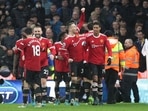 Manchester United's Anthony Elanga celebrates scoring their fourth goal with Scott McTominay and teammates