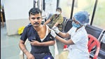 A health worker inoculates a beneficiary with a Covid-19 vaccine jab in Thane. HT photo A health worker inoculates a beneficiary with a Covid-19 vaccine jab in Thane. HT photo