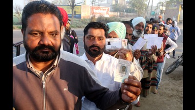 People standing in queue outside a polling booth during the Punjab assembly elections in Bathinda on Sunday. (Sanjeev Kumar/HT) People standing in queue outside a polling booth during the Punjab assembly elections in Bathinda on Sunday. (Sanjeev Kumar/HT)
