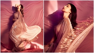 Mouni Roy's Instagram handle is a treat for all fashion lovers. It is flooded with pictures of herself in fancy outfits. Every time she posts photos in a stylish designer fit, netizens go gaga over her look. In her latest stills, the actor can be seen laying fashion cues to raise the elegant quotient in a shimmery ivory saree teamed with a sleeveless blouse. (Instagram/@imouniroy) Mouni Roy's Instagram handle is a treat for all fashion lovers. It is flooded with pictures of herself in fancy outfits. Every time she posts photos in a stylish designer fit, netizens go gaga over her look. In her latest stills, the actor can be seen laying fashion cues to raise the elegant quotient in a shimmery ivory saree teamed with a sleeveless blouse. (Instagram/@imouniroy)