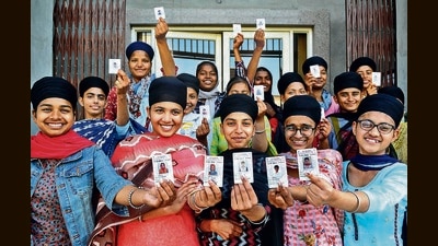 First-time voters thrilled after exercising their franchise in the Punjab assembly elections at a polling booth in Sector 78, Mohali, on Sunday. Of the 7.94 lakh registered voters in Mohali district, 5.01 lakh showed up to seal the fate of 40 candidates in the fray. (Ravi Kumar/HT)
