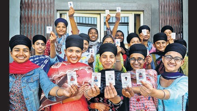First-time voters thrilled after exercising their franchise in the Punjab assembly elections at a polling booth in Sector 78, Mohali, on Sunday. Of the 7.94 lakh registered voters in Mohali district, 5.01 lakh showed up to seal the fate of 40 candidates in the fray. (Ravi Kumar/HT)