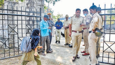 Previously, several colleges in Karnataka denied entry to the students despite the high court order that had directed that no religious attire will be allowed inside the classrooms until the hearing on the matter concludes. (PTI) Previously, several colleges in Karnataka denied entry to the students despite the high court order that had directed that no religious attire will be allowed inside the classrooms until the hearing on the matter concludes. (PTI)