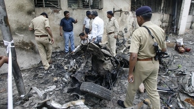 Forensic experts collecting evidence from a blast site outside the Civil Hospital in Ahmedabad. The photo was taken on July 27, 2008. (AFP) Forensic experts collecting evidence from a blast site outside the Civil Hospital in Ahmedabad. The photo was taken on July 27, 2008. (AFP)