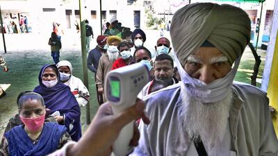 Covid protocol being followed at a polling station during the Punjab assembly election in Ludhiana. (Gurpreet Singh/HiT Photo) Covid protocol being followed at a polling station during the Punjab assembly election in Ludhiana. (Gurpreet Singh/HiT Photo)