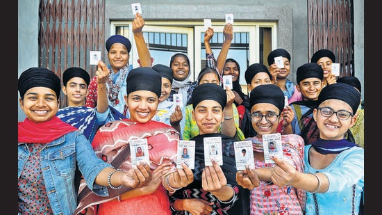 First-time voters thrilled after exercising their franchise in the Punjab assembly elections at a polling booth in Sector 78, Mohali, on Sunday. Of the 7.94 lakh registered voters in Mohali district, 5.01 lakh showed up to seal the fate of 40 candidates in the fray. (Ravi Kumar/HT)