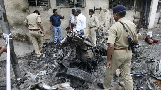 Forensic experts collecting evidence from a blast site outside the Civil Hospital in Ahmedabad. The photo was taken on July 27, 2008.&nbsp;(AFP)