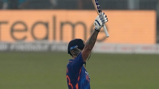 India's Suryakumar Yadav raises his bat to celebrate scoring fifty runs during the third Twenty20 international cricket match between India and West Indies in Kolkata, India, Sunday, Feb. 20, 2022. (AP Photo/Bikas Das)(AP)