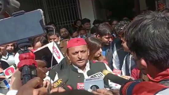 Samajwadi Party chief Akhilesh Yadav speaks to reporters after casting his vote at booth number 239 of Saifai village of Jaswant Nagar seat. (HT Photo)