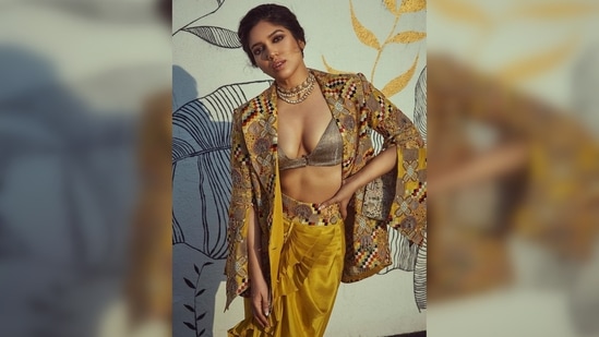 Bhumi Pednekar's outfit comprised of a bronze bralette, a ruffled dhoti style skirt with embroidered waist and a fully embroidered jacket.(Instagram/@bhumipednekar)