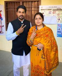 Moga Congress candidate Malvika Sood Sachar with her husband after voting on Sunday. (HT Photo) Moga Congress candidate Malvika Sood Sachar with her husband after voting on Sunday. (HT Photo)