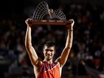 Carlos Alcaraz of Spain holds up his trophy after winning the final match of the Rio Open tennis tournament against Diego Schwartzman of Argentina, in Rio de Janeiro, Brazil, Sunday, Feb. 20, 2022. Carlos Alcaraz of Spain holds up his trophy after winning the final match of the Rio Open tennis tournament against Diego Schwartzman of Argentina, in Rio de Janeiro, Brazil, Sunday, Feb. 20, 2022. 