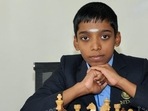 This handout photograph released by the Velammal School on June 25, 2018, and taken on February 12, 2018, shows Indian chess prodigy Rameshbabu Praggnanandhaa posing for a photograph with a chess board at the school in Chennai.(PTI) This handout photograph released by the Velammal School on June 25, 2018, and taken on February 12, 2018, shows Indian chess prodigy Rameshbabu Praggnanandhaa posing for a photograph with a chess board at the school in Chennai.(PTI)