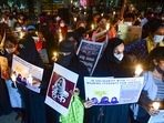 Citizens hold placards and candles in support of the hijab-wearing students, Bengaluru, February 19, 2022.&nbsp;