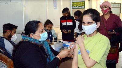 A beneficiary reacts as she gets inoculated with a dose of the Covid-19 vaccine, at a vaccination centre, in Gurugram on Monday. (ANI) A beneficiary reacts as she gets inoculated with a dose of the Covid-19 vaccine, at a vaccination centre, in Gurugram on Monday. (ANI)