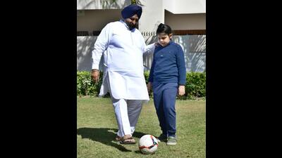Shiromani Akali Dal’s Ludhiana West candidate Maheshinder Singh Grewal, who was seen playing football with his grandson in a park close to his residence. (Harsimar Pal Singh/HT)