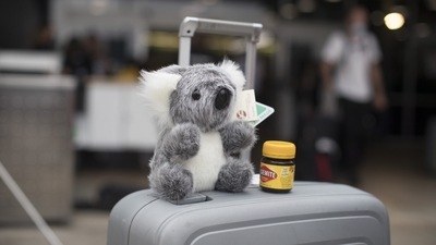 A stuffed koala toy and a jar of Vegemite on a suitcase at Sydney Airport in Sydney, Australia, on Monday, Feb. 21, 2022. Australia reopened its international borders to double-vaccinated visitors today, following almost two years of strict travel bans introduced to stem the spread of Covid-19. (Bloomberg) A stuffed koala toy and a jar of Vegemite on a suitcase at Sydney Airport in Sydney, Australia, on Monday, Feb. 21, 2022. Australia reopened its international borders to double-vaccinated visitors today, following almost two years of strict travel bans introduced to stem the spread of Covid-19. (Bloomberg)