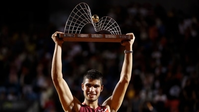 Carlos Alcaraz of Spain holds up his trophy after winning the final match of the Rio Open tennis tournament against Diego Schwartzman of Argentina, in Rio de Janeiro, Brazil, Sunday, Feb. 20, 2022. (AP) Carlos Alcaraz of Spain holds up his trophy after winning the final match of the Rio Open tennis tournament against Diego Schwartzman of Argentina, in Rio de Janeiro, Brazil, Sunday, Feb. 20, 2022. (AP)