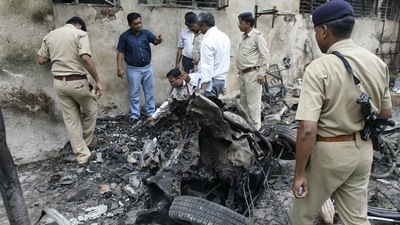 Forensic experts collecting evidence from a blast site outside the Civil Hospital in Ahmedabad. The photo was taken on July 27, 2008.&nbsp;