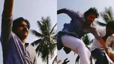 Pawan Kalyan falls from his car after a fan tries to hug him. Pawan Kalyan falls from his car after a fan tries to hug him.
