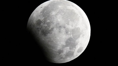 The moon is seen during a partial lunar eclipse in Shanghai January 1, 2010.&nbsp; (REUTERS)